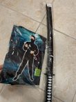 Fekete ninja jelmez világító karddal